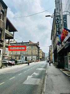 an empty street in a city with buildings at Apartman Katedrala in Sarajevo +36 photos