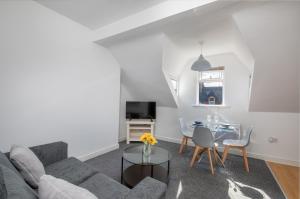 a living room with a couch and a table at Thornhill House in Hartlepool