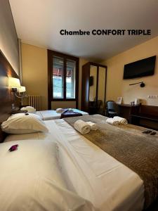 Hôtel Terminus - Pizzeria Pizz'a gogo - salle de sport - face à la gare客房内的一张或多张床位