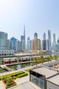 a view of a city skyline with tall buildings at Downtown Ultra Luxury 1BR - 15 Northside - Burj Khalifa View in Dubai