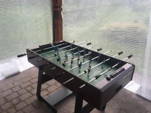 a foosball table with a chess board on it at Uroczysko Terebiski in Sławatycze