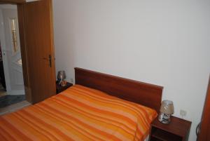 Postel nebo postele na pokoji v ubytování Apartments Kairos - Bili 9