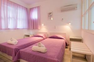Postel nebo postele na pokoji v ubytování Markakis Apartments