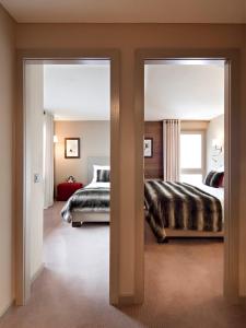 Voodi või voodid majutusasutuse Hôtel Vanessa toas