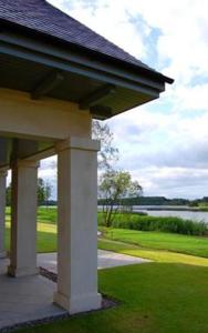 a pavilion with a view of a golf course at Lough Erne Fisherman's Cottage in Enniskillen