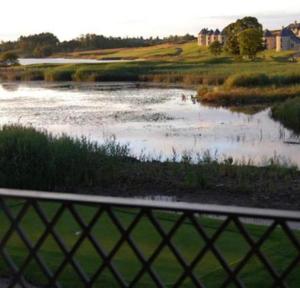 a view of a river from a fence at Lough Erne Fisherman's Cottage in Enniskillen