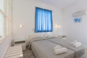 Postel nebo postele na pokoji v ubytování Markakis Apartments