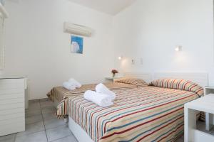 Postel nebo postele na pokoji v ubytování Markakis Apartments