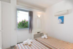 Postel nebo postele na pokoji v ubytování Markakis Apartments