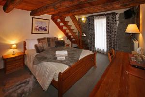 a bedroom with a large bed in a room at Chalet Faure in Sauze dʼOulx