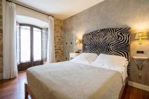Cama o camas de una habitación en YIT La Casona del Arco