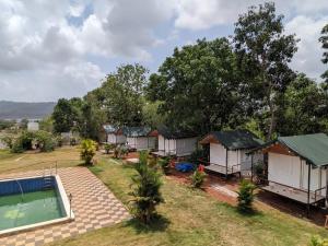 an aerial view of a resort with a pool at Panshet Camping in Welhe