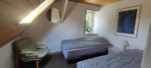Postel nebo postele na pokoji v ubytování Bøllingsø Camping