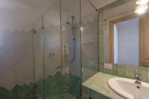 a bathroom with a shower and a sink at Villetta Bomboniera in Arzachena
