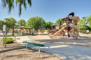 un parque infantil con tobogán en Relaxing Phoenix Home with Patio and Fenced-In Yard en Phoenix