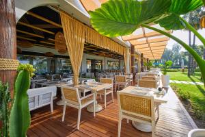 A restaurant or other place to eat at Rixos Premium Göcek - Adult Only