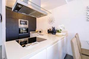 a kitchen with a white counter top and appliances at Samaniego ID175 in Orihuela Costa