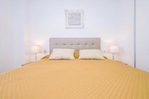 a large bed with two pillows on top of it at Samaniego ID175 in Orihuela Costa +20 photos