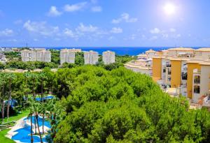 a view of a resort with a pool and the ocean at Samaniego ID175 in Orihuela Costa