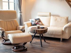 a living room with a couch and two chairs and a table at Holiday home in Uttendorf in the mountains in Uttendorf