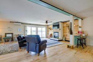 a living room with two chairs and a fireplace at Waterfront Conway Area Condo Walk to Beach! in Silver Lake