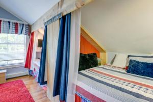 a small bedroom with a bed and a window at Waterfront Conway Area Condo Walk to Beach! in Silver Lake