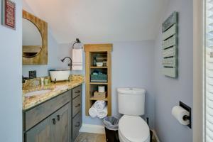 a bathroom with a toilet and a sink at Waterfront Conway Area Condo Walk to Beach! in Silver Lake +19 photos