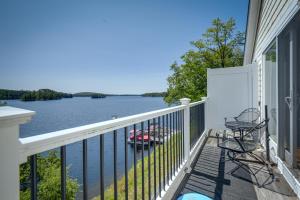 a balcony with two chairs and a view of a lake at Waterfront Conway Area Condo Walk to Beach! in Silver Lake