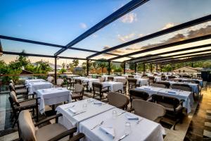 A restaurant or other place to eat at Rixos Premium Göcek - Adult Only