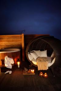 a circular bed on a boat with two candles at Axel Guldsmeden in Copenhagen