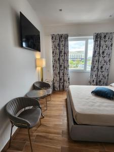 Postel nebo postele na pokoji v ubytování B&B Mini Hotel Incity-close train station and port-