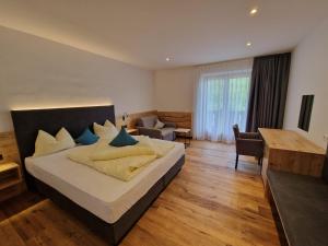 Voodi või voodid majutusasutuse Hotel Mignon toas