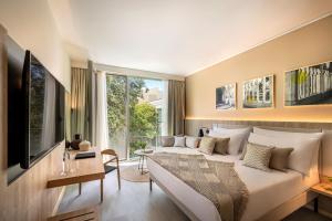Телевизор и/или развлекательный центр в Valamar Tirena Hotel
