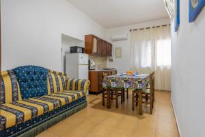 a living room with a couch and a table at Casa Vacanze Cappuccini in Palermo