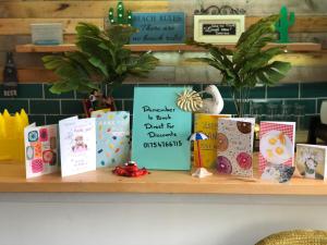 a shelf with some books on it at The Skegness Hotel in Skegness