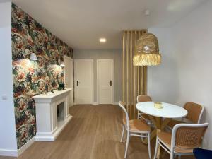 a dining room with a table and a fireplace at Isabella Center Boutique in Toledo +15 photos