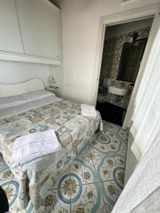 Posteľ alebo postele v izbe v ubytovaní L'Incanto