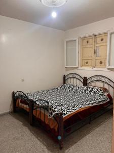 Un pat sau paturi într-o cameră la Appartement 19
