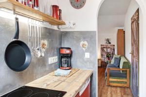 a kitchen with a coffee maker on a counter at Aschaubichl - Wohnung Anemone in Grainau