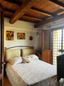 a bedroom with a bed with a teddy bear on it at La Maggiorana in Tagliacozzo