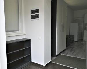 een keuken met witte muren en een witte koelkast bij Bright and cozy apartment nr. 1 in Chişinău