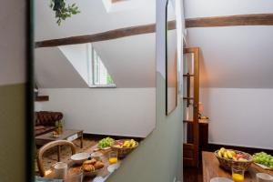 a kitchen with a table with fruit on it at Manoir d'Egrefin in Saint-Martin-dʼAbbat