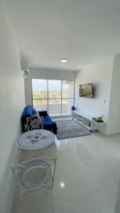 a living room with a couch and a table at Apartamento muy cerca al Mar!-0k in Cartagena de Indias