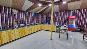 a coca cola machine in a room with a person in it at Darien Luxury Camp in Wadi Rum