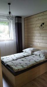 Cama o camas de una habitación en Bieszczadzki Zakątek 787-899-185