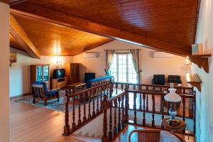 a view of a living room with a wooden ceiling at Casa Malheiro in Ponte de Lima
