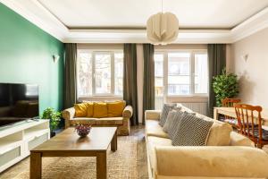 a living room with two couches and a tv at Modern and Central Flat in Nisantasi in Istanbul