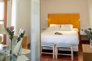 Łóżko lub łóżka w pokoju w obiekcie Hotel Rural Spa Don Juan de Austria