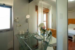 Łóżko lub łóżka w pokoju w obiekcie Hotel Rural Spa Don Juan de Austria