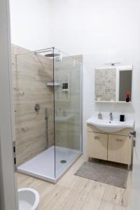 a bathroom with a shower and a sink at Le stanze di Dalia in Crotone